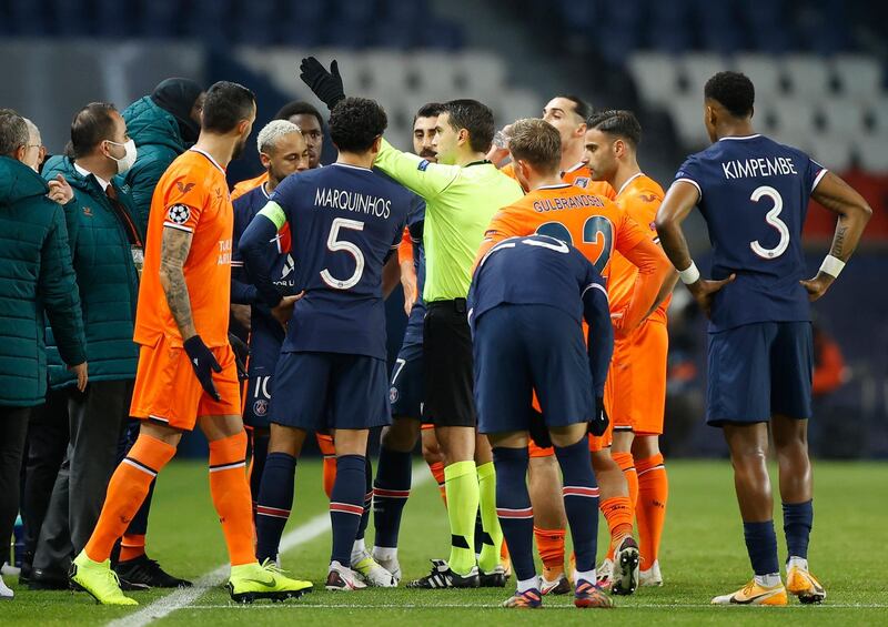 Demba Ba, Basaksehir player, talks to referee Ovidiu Hategan before the match is abandoned. EPA