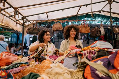 Fatma Aissa, left, and Wided Asly run Goya Thrift, an Instagram shop dedicated to their fripe finds. Erin Clare Brown / The National