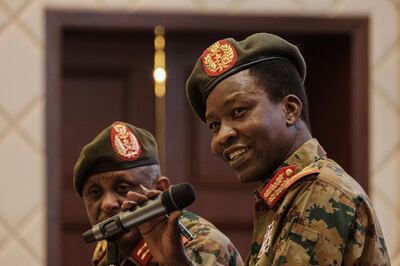 Sudan's Transitional Military Council (TMC) spokesman Shams-Eddin Kabashi (R) speaks during a press conference at the Presidencial Palace in Khartoum, Sudan, on June 13, 2019. - Sudan's ruling military council for the first time admitted on June 13, 2019 that it had ordered the dispersal of a Khartoum sit-in, which left dozens dead, as US and African diplomats stepped up efforts for a solution to the country's political crisis. (Photo by Yasuyoshi CHIBA / AFP)
