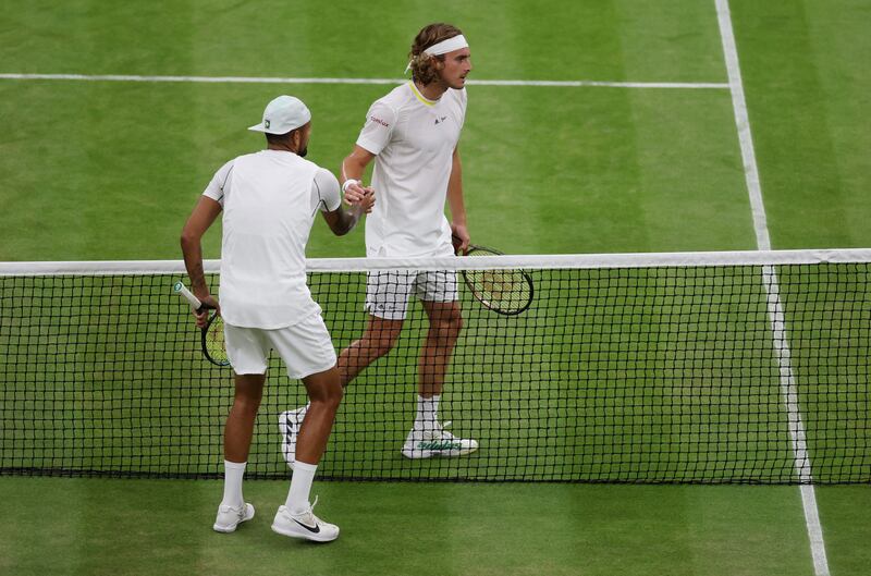 Nick Kyrgios and Stefanos Tsitsipas shake hands at the net after their third round match on day six at Wimbledon at All England Lawn Tennis and Croquet Club on July 02, 2022. Getty