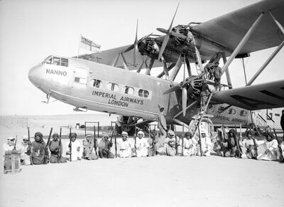 The Imperial Airways Hannibal Class Handley Page HP42 passenger plane Hanno, surrounded by an armed guard provided by the Sheikkh of Sharjah during a refuelling stop at Kuwait.   (Photo by Fox Photos/Getty Images)