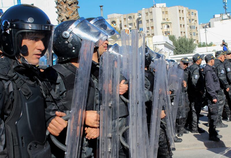 Riot police face demonstrators during a rally against President Kais Saied in the Tunisian capital, Tunis, in November. AFP