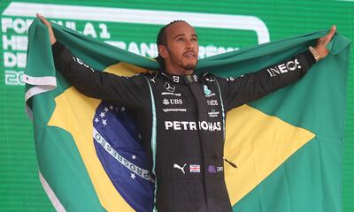 Mercedes driver Lewis Hamilton celebrates after the winning the 2021 Brazilian Grand Prix. AP