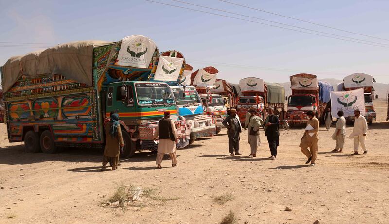 Lorries carrying food aid donated by the Pakistan government wait to cross into Afghanistan at the Chaman border. Photo: EPA