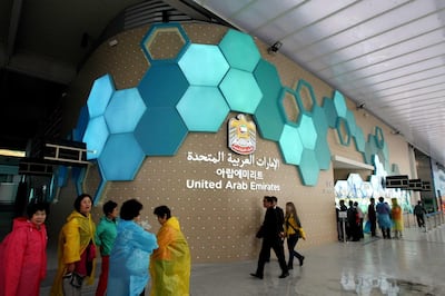 In this photo taken on Monday, May 14, 2012, visitors walk past near the UAE  Pavilion for the 2012 Yeosu Expo in Yeosu, south of Seoul, South Korea. The expo opened for three months on May 12 under the theme of "The Living Ocean and Coast: Diversity of Resources and Sustainable Activities." (AP Photo/Newsis, Ahn Hyun-joo) KOREA OUT