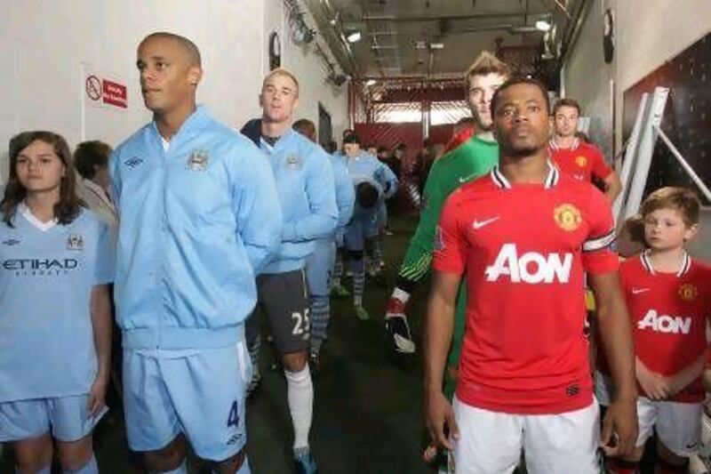 The two teams line up in the tunnel before October's derby at Old Trafford, which City famously won 6-1. John Peters / Man Utd via Getty Images