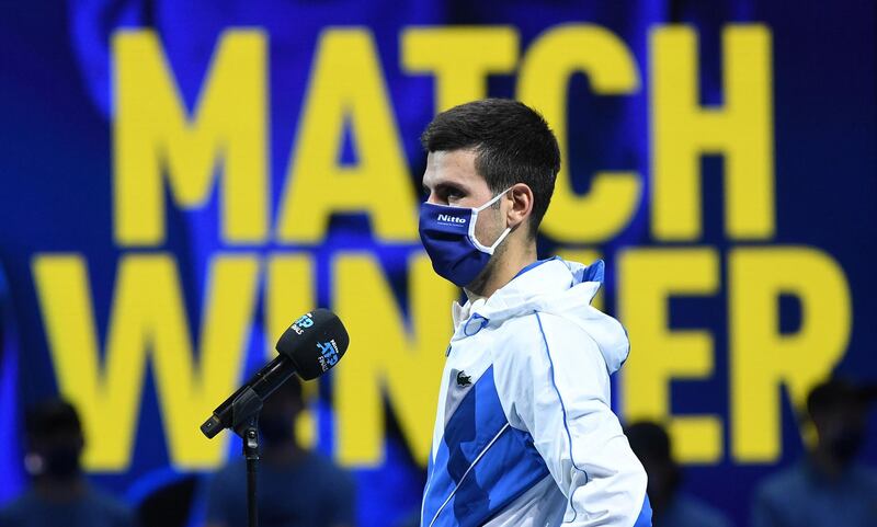 Novak Djokovic,, wearing a protective face mask, addresses the media after winning against Alexander Zverev. EPA