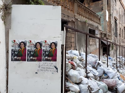 Posters hang on the walls amid the rubbish in Basta, Beirut India Stoughton