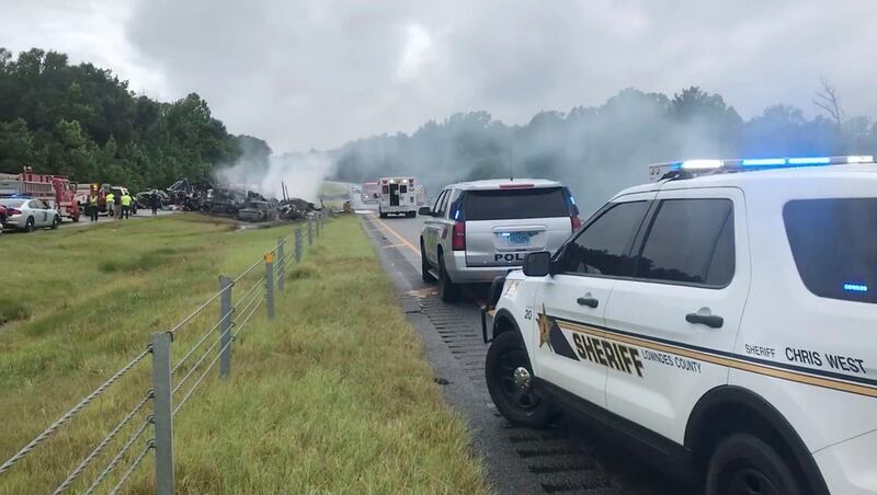 Police and emergency workers gather at the scene of the pile-up. Reuters