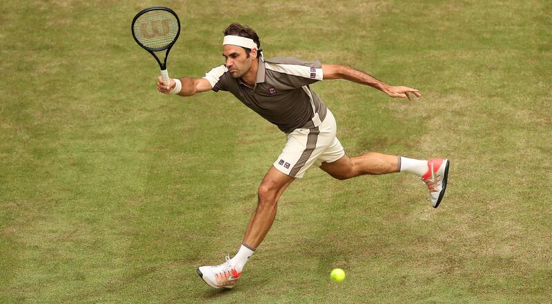 epa07656374 Roger Federer from Switzerland in action during his first round match against John Millman from Australia at the ATP Tennis Tournament Gerry Weber Open in Halle Westphalia, Germany, 18 June 2019.  EPA/FRIEDEMANN VOGEL