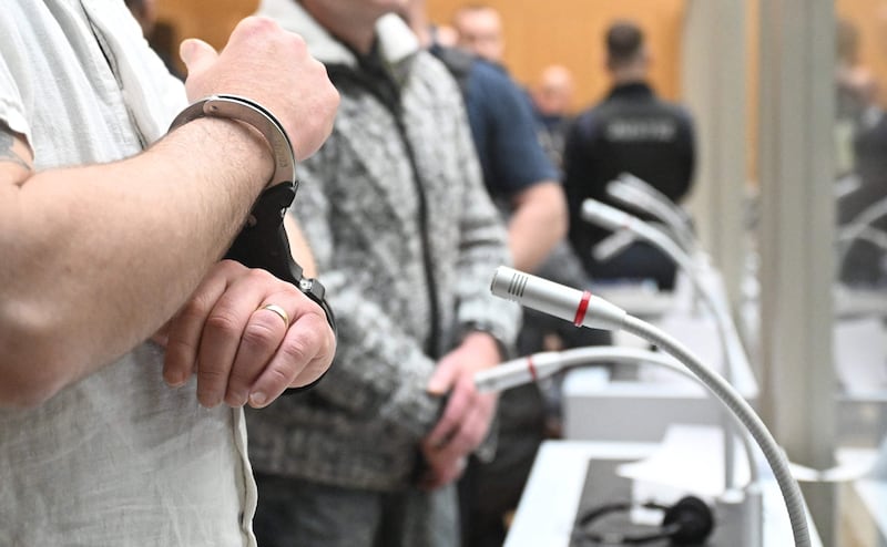 One of nine suspected participants in a coup plot is brought to the courtroom to take the stand in the first set of proceedings in Stuttgart, Germany. AFP