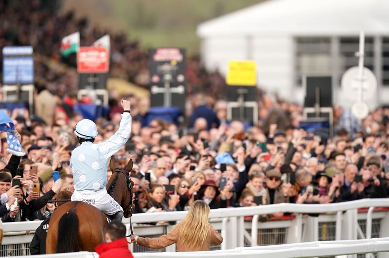 Jockey Rachael Blackmore riding Honeysuckle gestures to the crowd after winning the Champion Hurdle during day one of the Cheltenham Festival. PA