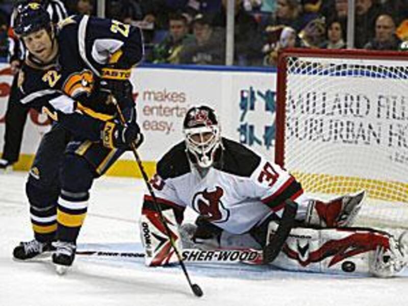 Martin Brodeur, right, made 22 saves in the Devils' 3-0 win.