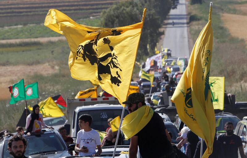 Supporters of Lebanon's Hezbollah leader Sayyed Hassan Nasrallah ride in a convoy marking Resistance and Liberation Day, in Kfar Kila village, near the border with Israel, southern Lebanon, May 25, 2021. REUTERS/Aziz Taher