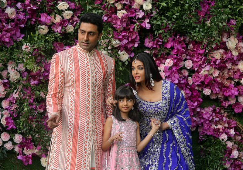 FILE PHOTO: Actor Abhishek Bachchan, his wife actress Aishwarya Rai and their daughter Aaradhya pose during a photo opportunity at the wedding ceremony of Akash Ambani, son of the Chairman of Reliance Industries Mukesh Ambani, at Bandra-Kurla Complex in Mumbai, India, March 9, 2019. REUTERS/Francis Mascarenhas/File Photo