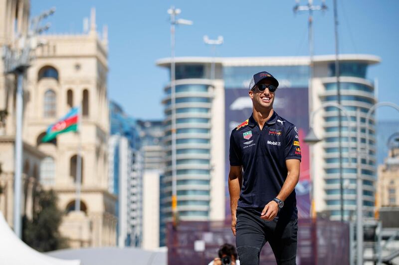 epa06694120 Australian Formula One driver Daniel Ricciardo of Aston Martin Red Bull Racing walks through the paddock at the Baku City Circuit in Baku, Azerbaijan, 26 April 2018. The 2018 Formula One Grand Prix of Azerbaijan will take place on 29 April.  EPA/VALDRIN XHEMAJ