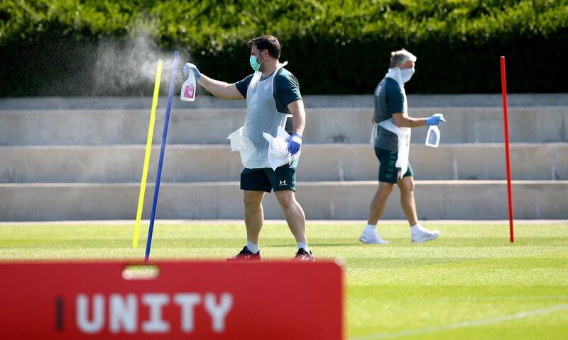 SOUTHAMPTON, ENGLAND - MAY 19: Fitness Coach Steve Wright cleans down equipment after use as Southampton FC players return to training following Covid-19 restrictions being relaxed, at the Staplewood Campus on May 19, 2020 in Southampton, England. (Photo by Matt Watson/Southampton FC via Getty Images)