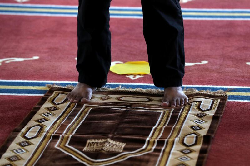 Dubai, United Arab Emirates - December 03, 2020: Social distancing markers at Al Farooq Omar Bin Al Khattab Mosque during prayers. Thursday, December 3rd, 2020 in Dubai. Chris Whiteoak / The National