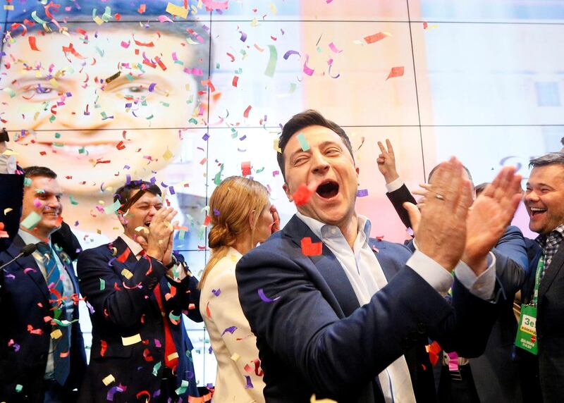 FILE PHOTO: Ukrainian presidential candidate Volodymyr Zelenskiy reacts following the announcement of the first exit poll in a presidential election at his campaign headquarters in Kiev, Ukraine April 21, 2019./File Photo