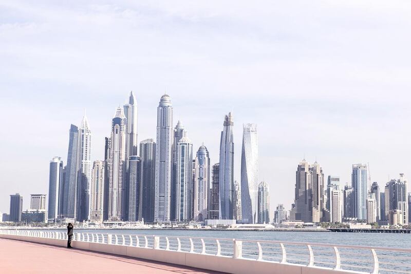 The Dubai skyline at Palm Jumeirah's beach. Reem Mohammed / The National 

