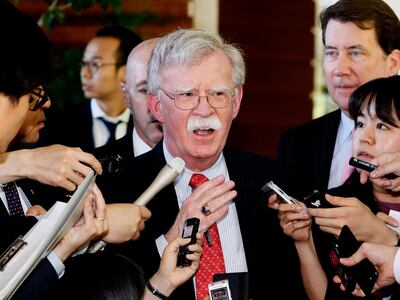 FILE - In this Friday, May 24, 2019, file photo, U.S. National Security Adviser John Bolton is surrounded by reporters at the prime minister's official residence in Tokyo, Japan. North Korea on Monday, May 27, 2019, has called U.S. National Security Adviser Bolton a "war monger" and "defective human product" after he called the North's recent tests of short-range missile a violation of U.N. Security Council resolutions. (Yohei Kanasashi/Kyodo News via AP, File)