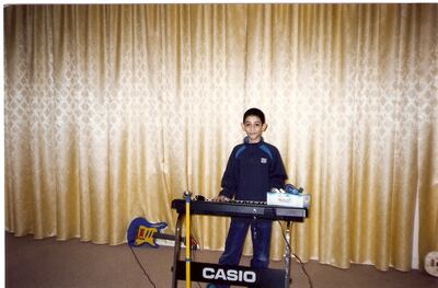 Hamad Al Taee with one of the first keyboards his father ever bought him. He is a self-taught musician.
CREDIT: Courtesy Hamad Al Taee