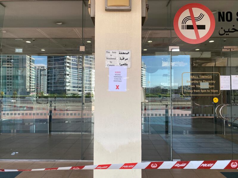 A notice displayed outside Al Mulla Plaza in Dubai. The National