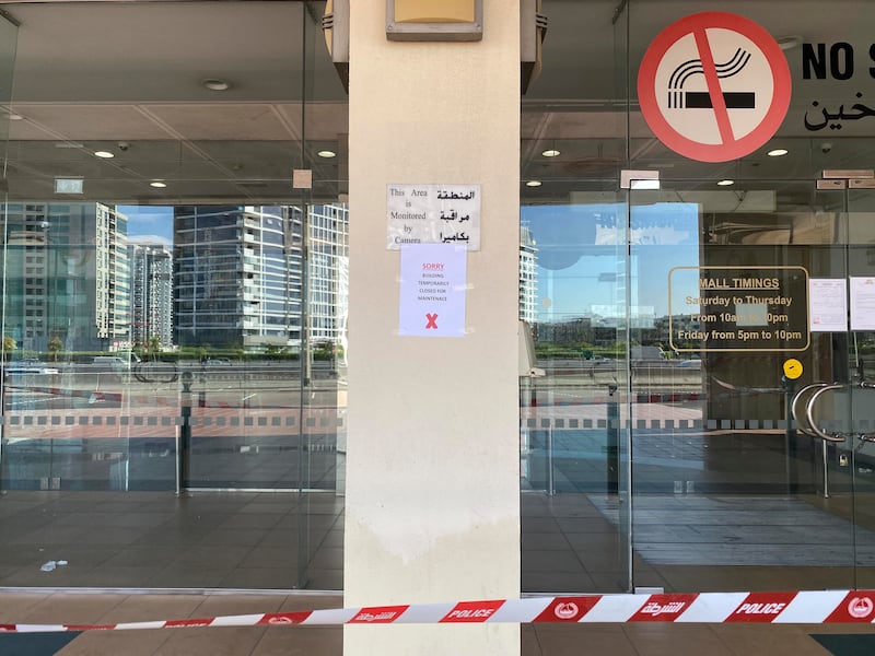 A notice displayed outside Al Mulla Plaza in Dubai. The National