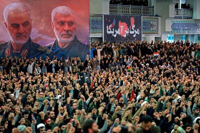 FILE - In this Jan. 17, 2020 file photo, released by the official website of the office of the Iranian supreme leader, worshippers chant slogans during Friday prayers ceremony, as a banner show Iranian Revolutionary Guard Gen. Qassem Soleimani, left, and Iraqi Shiite senior militia commander Abu Mahdi al-Muhandis, who were killed in Iraq in a U.S. drone attack on Jan. 3, and a banner which reads in Persian: "Death To America, "at Imam Khomeini Grand Mosque in Tehran, Iran. On Thursday, Jan. 7, 2021, Iraqâ€™s judiciary issued an arrest warrant for outgoing U.S. President Donald Trump in connection with the killing of Soleimani and a al-Muhandis last year. The warrant was issued by a judge in Baghdadâ€™s investigative court tasked with probing the Washington-directed drone strike, the courtâ€™s media office said. (Office of the Iranian Supreme Leader via AP, File)