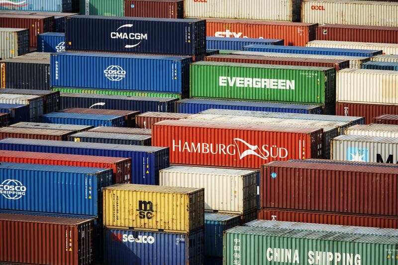 Shipping containers sit stacked at the Yangshan Deepwater Port, operated by Shanghai International Port Group Co. (SIPG), in Shanghai, China, on Friday, May 10, 2019. The U.S. hiked tariffs on more than $200 billion in goods from China on Friday in the most dramatic step yet of President Donald Trump's push to extract trade concessions, deepening a conflict that has roiled financial markets and cast a shadow over the global economy. Photographer: Qilai Shen/Bloomberg