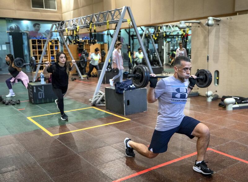 Ihsan Al Sakka does weight training and cardio excercises with his children, Huda, 15 and Nur, 20 at the Abu Dhabi Country Club on June 1st, 2021. Victor Besa / The National.
Reporter: Haneen Dajani for News