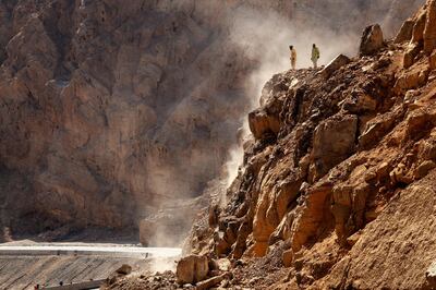 Ras al Khamiah, United Arab Emirates, November 4, 2014:     Workers remove rocks that feel onto the road heading up the wadi to Jebel Jais in Ras al Khamiah on November 4, 2014. Christopher Pike / The National

Reporter:  N/A
Section: Focal Point




