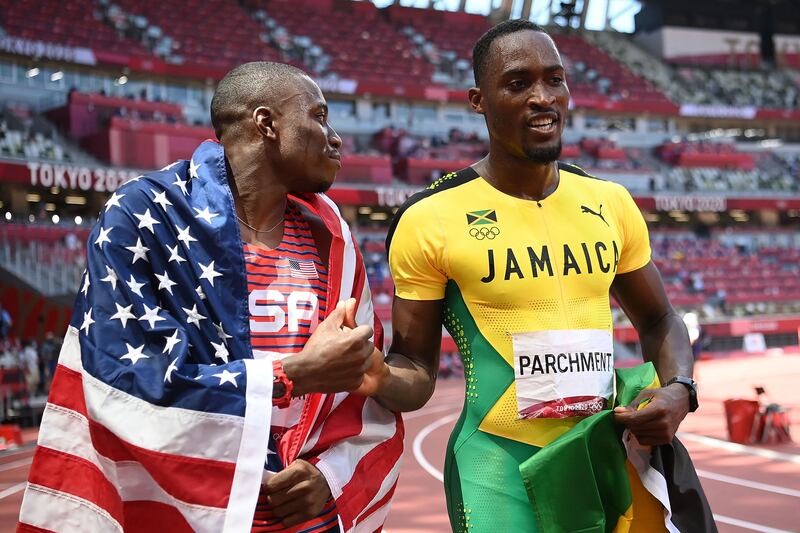 Gold medallist  Jamaica's Hansle Parchment shakes hands with silver medallist Grant Holloway of USA.