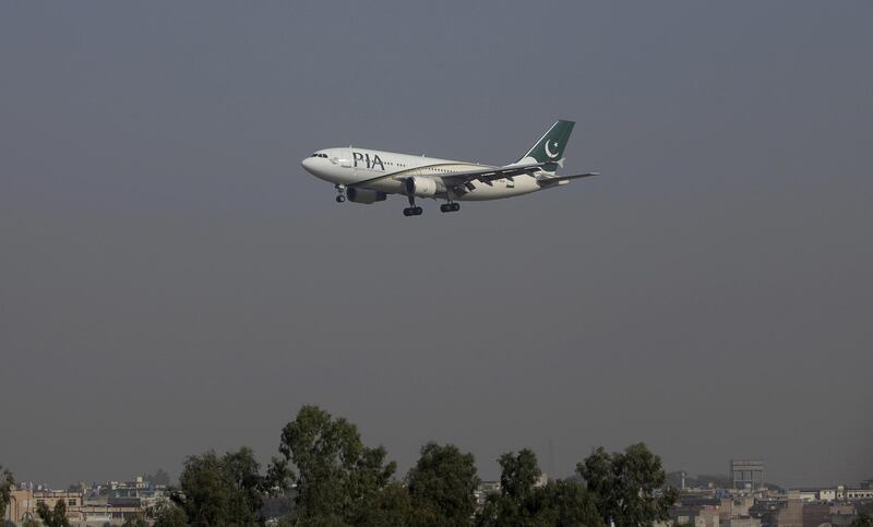 FILE PHOTO: A Pakistan International Airlines (PIA) passenger plane arrives at the Benazir International airport in Islamabad, Pakistan, December 2, 2015. Employees of Pakistan's ailing national airline on December 15, 2015, walked out in protest over its planned privatisation, disrupting flights and undermining a central plank of reforms promised by Prime Minister Nawaz Sharif in return for an IMF bailout. Picture taken December 2, 2015. REUTERS/Faisal Mahmood - GF10000266349/File Photo