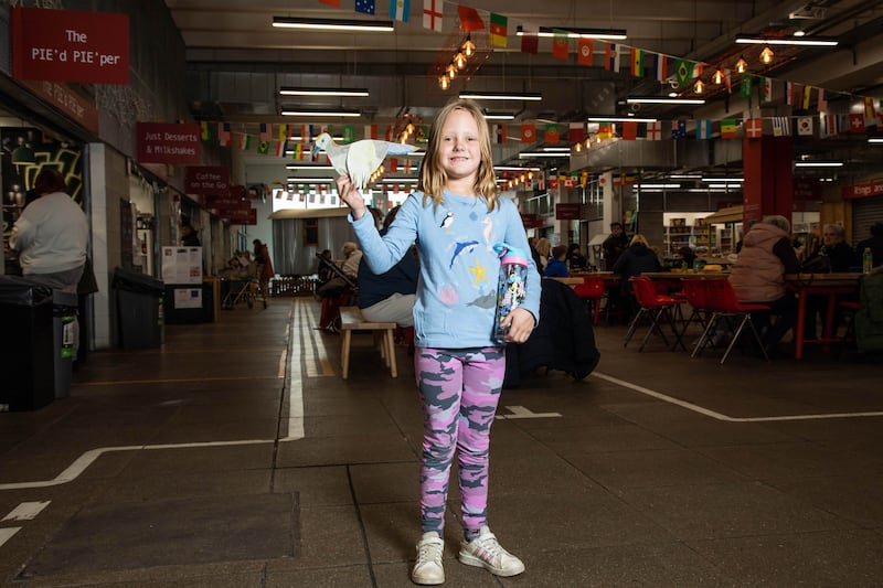 Ava with her bird in the food hall at Ty Pawb, Wrexham. The Wild Escape aims to inspire children to visit museums and respond creatively to the threat to the UK’s ecosystems. PA