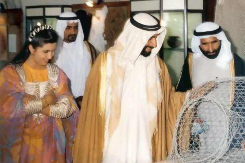 Reem Tariq El Mutwalli with Sheikh Zayed at an exhibition at the Cultural Foundation in the 1990s.