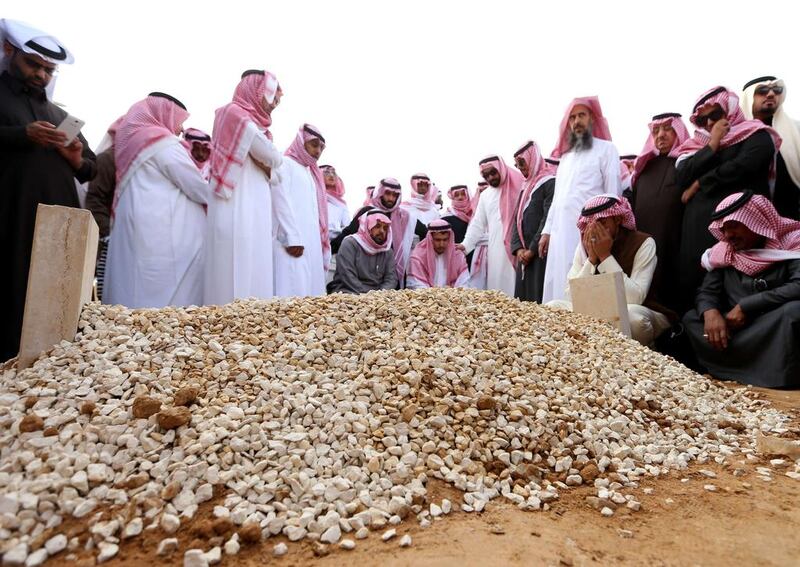 Mourners gather around the grave of Saudi Arabia's King Abdullah in Riyadh on January 23 following his death in the early hours of the morning. Mohammed Mashhur / AFP Photo

