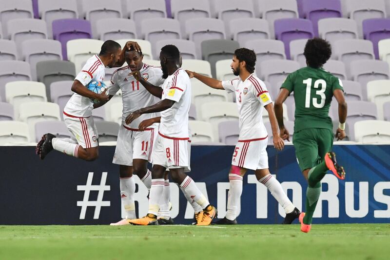 UAE's forward Ahmed Khalil (2nd L) celebrates after scoring a goal during the 2018 FIFA World Cup qualifier football match between UAE and Saudi Arabia at the Hazza Bin Zayed Stadium in Al-Ain on August 29, 2017. / AFP PHOTO / GIUSEPPE CACACE