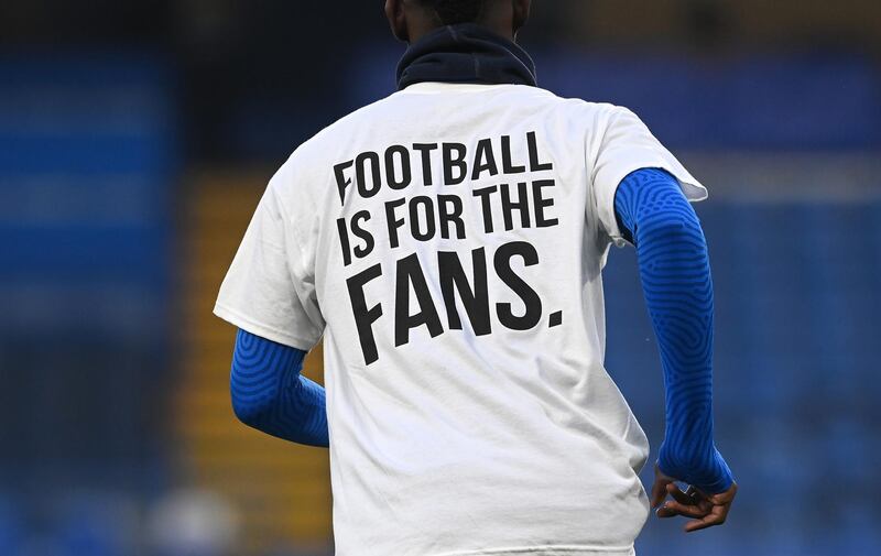 Brighton players warm up wearing a t-shirt with a message in protest against the European Super League. Getty