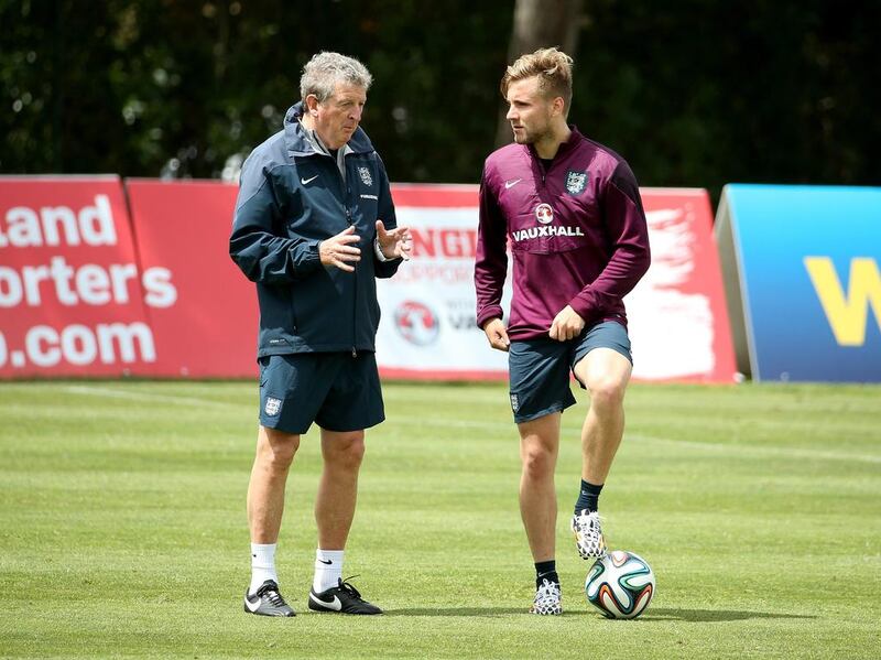 Manager Roy Hodgson talks with Luke Shaw during an England training session for the 2014 World Cup on Wednesday in Portugal. Richard Heathcote / Getty Images / May 21, 2014