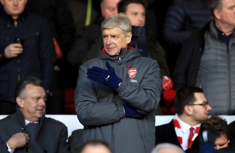 Arsenal manager Arsene Wenger gestures from the stands during the English FA Cup, Third Round soccer match between Nottingham Forest and Arsenal at the City Ground, Nottingham, England, Sunday, Jan. 7, 2018. (Mike Egerton/PA via AP)