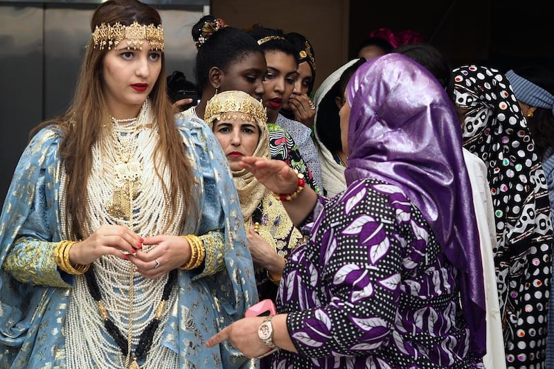 Mana Zeghlache, from Algeria, and other runway participants in a fashion show, that was a part of Africa Day celebrations at Paris Sorbonne University in Abu Dhabi, wait their turn to take to the runway. Delores Johnson / The National