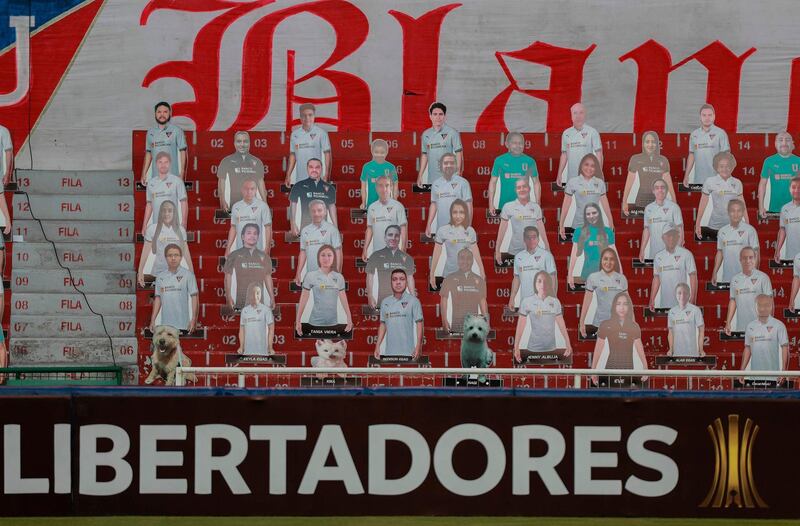 Cardboard figures of pictures of fans are seen on the stands before the start of the closed-door Copa Libertadores group phase football match between Ecuador's Liga de Quito and Brazil's Sao Paulo at the Rodrigo Paz Delgado stadium in Quito. AFP