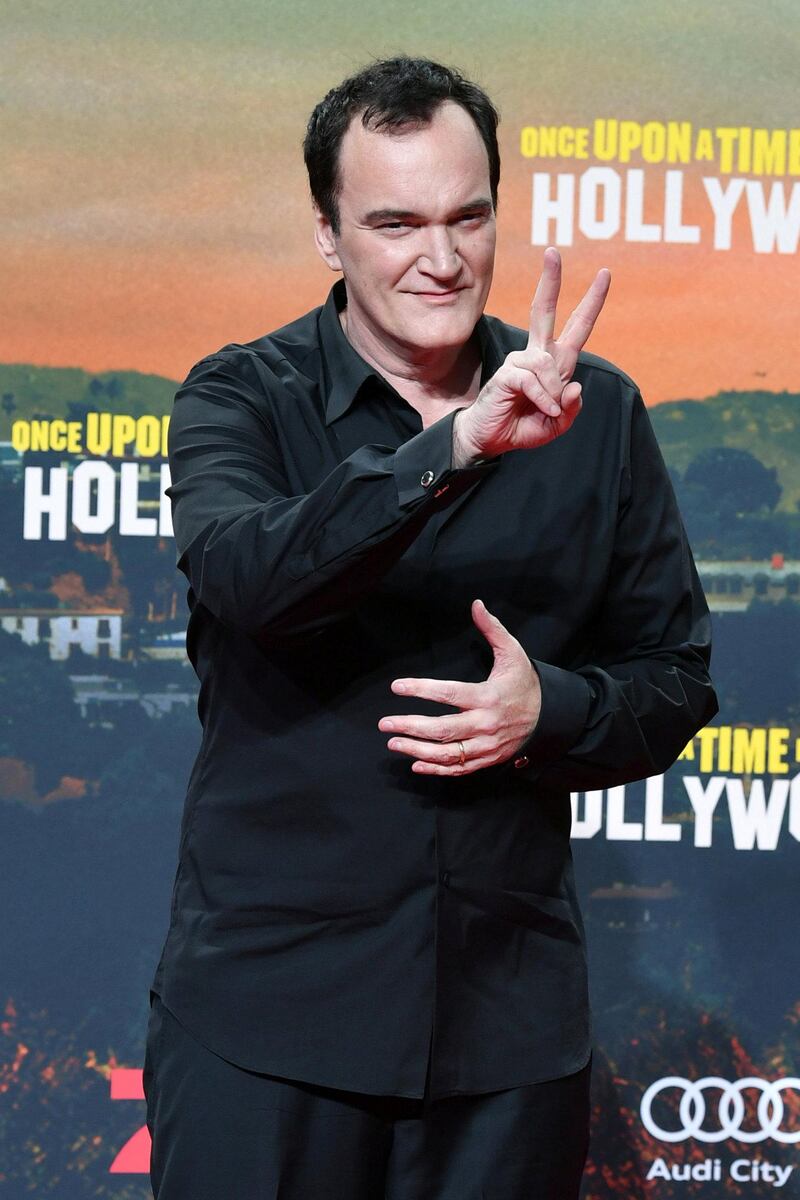 US director Quentin Tarantino poses during a photocall ahead of the German Premiere of his latest film "Once Upon A TimeÖ In Hollywood" in Berlin on August 1, 2019. (Photo by Jens Kalaene / dpa / AFP) / Germany OUT