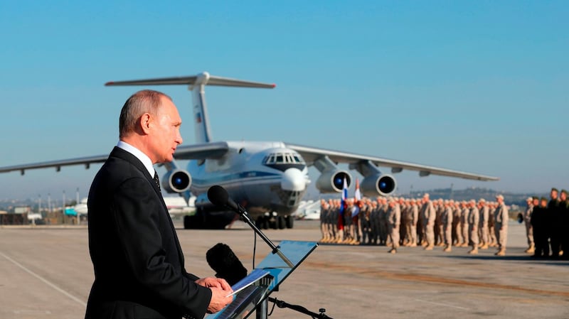 FILE - In this Dec. 12, 2017, file photo, Russian President Vladimir Putin addresses the troops at the Hemeimeem air base in Syria. Russia's deployment near the Syria-Lebanon border this week and its withdrawal a day later after protests from the militant Hezbollah group reveals some of the uneasy relations between allies of President Bashar Assad who joined the country's civil war to back him. The move comes amid calls by Russia for foreign countries to withdraw troops from Syria while Tehran says it presence will remain as long as there are threats from terrorists. (Mikhail Klimentyev/Pool Photo via AP, File)