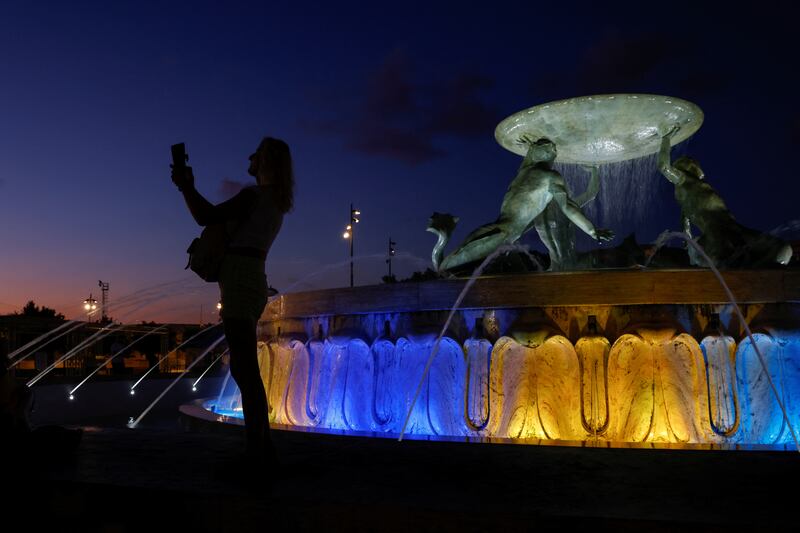The Triton Fountain in Valletta is lit in Ukrainian colours. Reuters