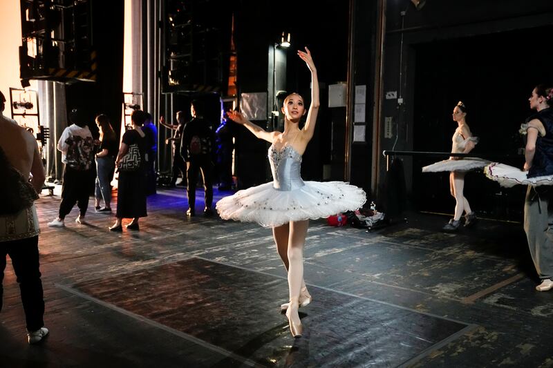 A dancer limbers up backstage at the XIV International Ballet Competition at Bolshoi Theatre in Moscow. AP
