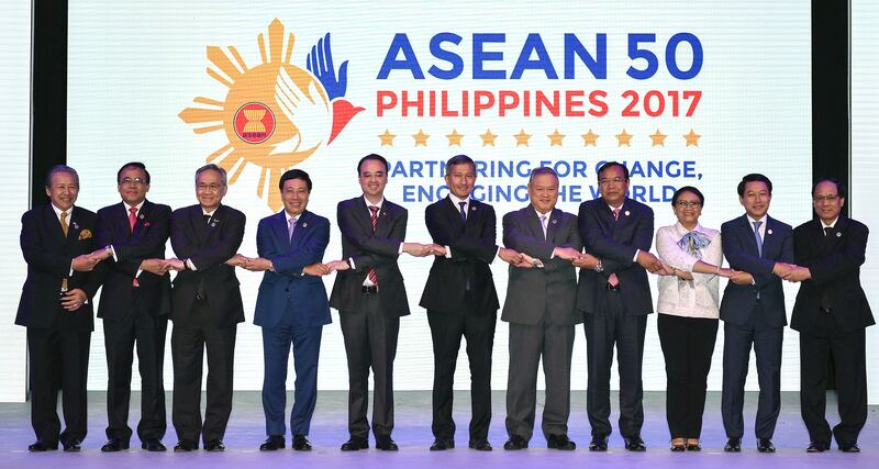 ASEAN Foreign Ministers link hands "The ASEAN Way" at the opening ceremony of the 50th ASEAN Foreign Ministers Meeting at the Philippine International Convention Center Saturday, Aug. 5, 2017 in suburban Pasay city, south of Manila, Philippines. They are, from left, Malaysia's Anifah Aman, Myanmar's U Kyaw Tin, Thailand's Don Pramudwinai, Vietnam's Pham Binh Minh, Philippines' Alan Peter Cayetano, Singapore's Vivian Balakrishnan, Brunei's Lim Jock Seng, Cambodia's Prak Sokhonn, Indonesia's Retno Marsudi, Laos' Saleumxay Kommasith and ASEAN Secretary-General Le Luong Minh. (AP Photo/Mohd Rasfan, Pool)