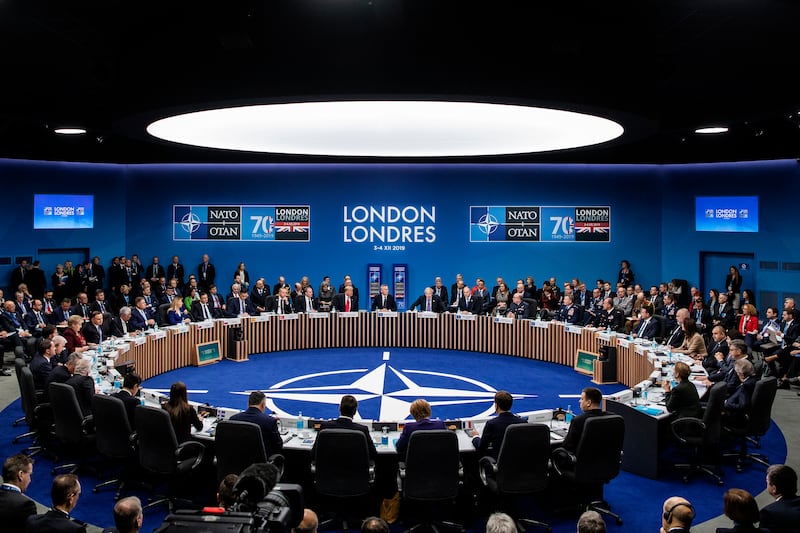 Nato leaders listen to British Prime Minister Boris Johnson while attending the summit in 2019 in Watford, England