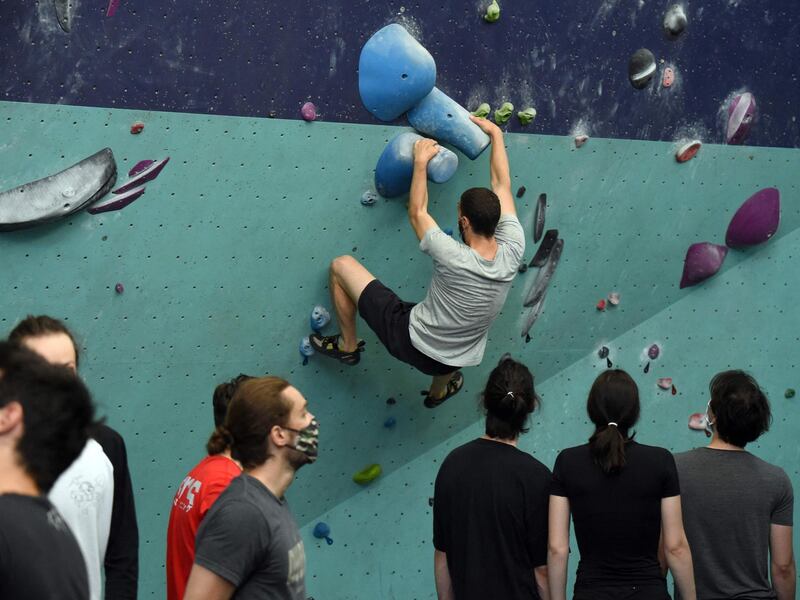 Climbers take part in the reopening of a climbing club in Paris. AFP